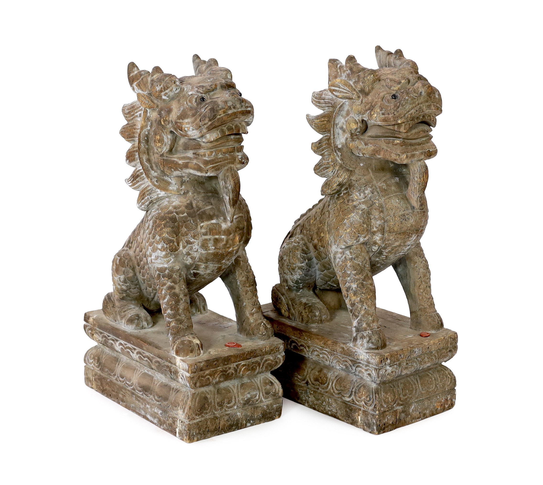 A pair of carved hardwood temple lions, height 69cm